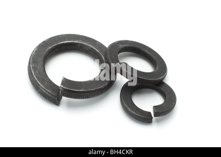 Three used metal washers on white background Stock Photo