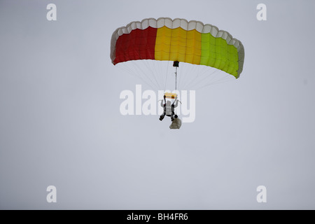 Parachute jumper coming in to land. Stock Photo