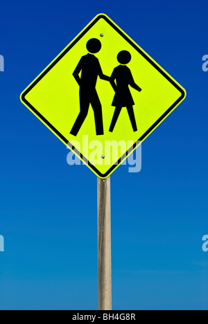 Pedestrian Crossing Sign isolated on a blue gradient sky Stock Photo