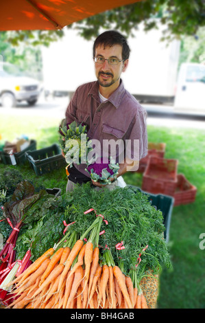 Farmer with produce, Riverdale Farmers's Market, Riverdale Farmer's Market, Toronto, Ontario Stock Photo