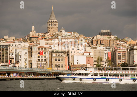 The North Bank of the Golden Horn, The Galata Tower, Tourist Boat, Istanbul, Turkey Stock Photo