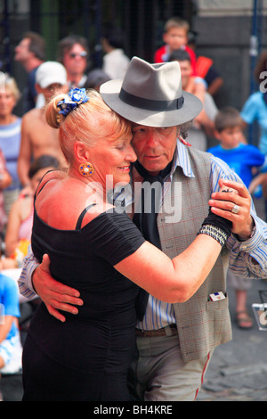 Old tango dancers ('Pochi y Osvaldo') at a street performance in San telmo Fair. San Telmo, Buenos Aires, Argentina Stock Photo