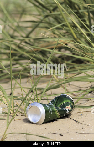 Empty beer can discarded on beach. Stock Photo