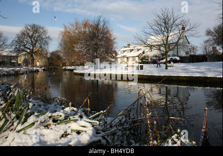 snowy scene village green Histon Cambridgeshire England UK Stock Photo
