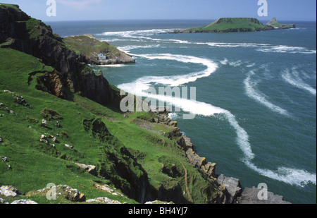 Scenic view of Worm's Head from the Gower peninsula, South Wales, on a sunny spring day. Stock Photo