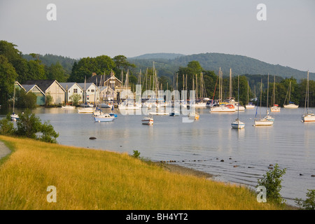 Sailing boats in harbour at dusk on Windermere Lake.