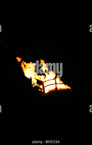 Torch against night sky Stock Photo