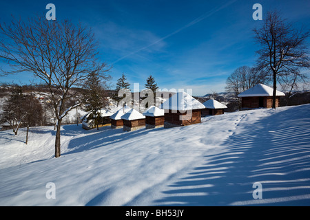 Idyllic Village Lelic, traditional Serbian architectu building 'vajat', house, architecture in West Serbia, winter, snow Stock Photo