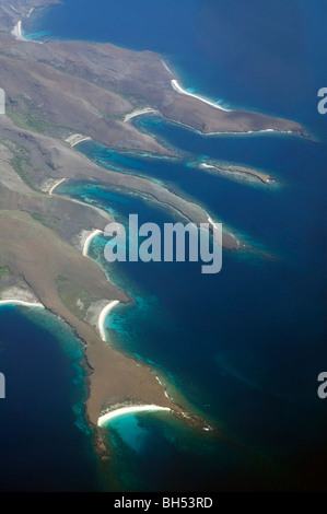 Aerial view of spectacular coastline and fringing coral reefs of Banta Island, Komodo Marine Park, Indonesia Stock Photo