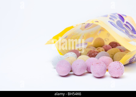 Cadburys cream eggs and mini eggs isolated against white background. Stock Photo