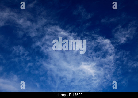 White Wispy Cirrus High clouds deep blue sky Stock Photo