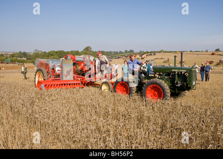 Sunshine Stripper Header Harvester & 1937 Massey Harris GP 4WD Tractor Stock Photo