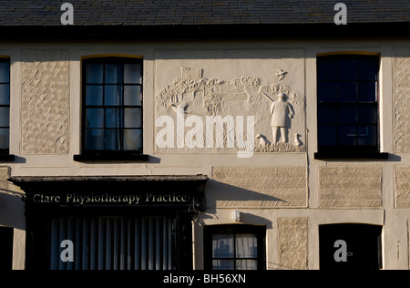 Pargeting or sometimes spelt Pargetting, on the front of a house in the rural village of Clare in Suffolk, Britain, showing a h Stock Photo