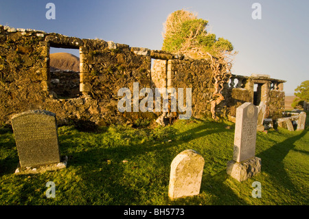 Cill Chriosd, ruined Celtic church with ivy growing over it, and graveyard, in front of the Red Cuillins, Isle of Skye. Stock Photo
