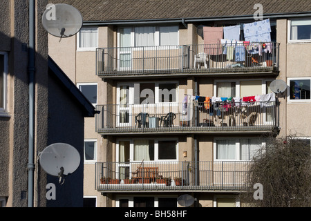 Satellite dishes and washing - council flats in Kelso, Scotland Stock Photo