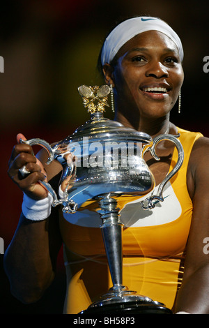 Serena Williams poses with the trophy after winning her women's final match against Justine Henin. 2010 Australian Open Stock Photo