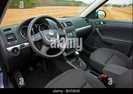 Interior with drivers seat and steering wheel, Skoda Yeti SUV 2010 model Stock Photo