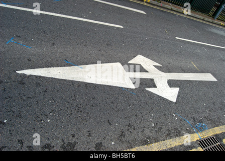 british road marking indicating traffic may turn left, right or go straight ahead Stock Photo