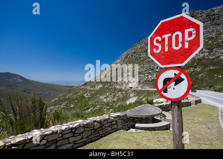 Bullet holes pierce a stop sign on the Outeniqua pass in the Western Cape, South Africa Stock Photo