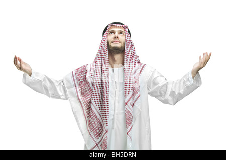 Arabic man praying, isolated on white background Stock Photo