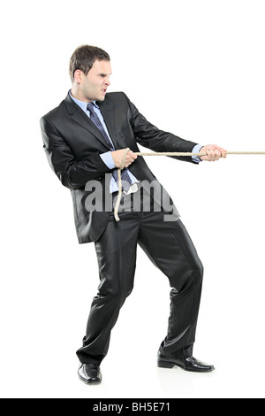 Businessman pulling a rope, isolated on white background