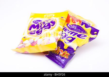 Cadburys cream eggs and mini eggs isolated against white background. Stock Photo