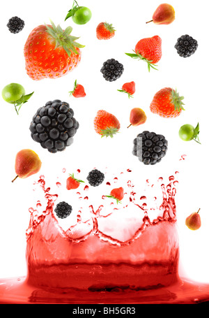 berry falling in juice. Isolation Stock Photo