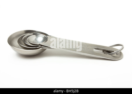 A set of cook's Measuring Spoons isolated against white background. Stock Photo