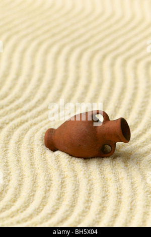 Abstract composition - Japanese zen garden with ancient ceramic amphora Stock Photo