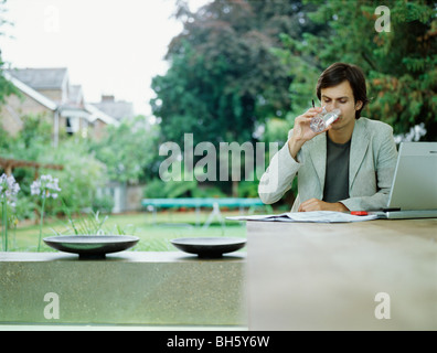 A young trendy male works from home Stock Photo