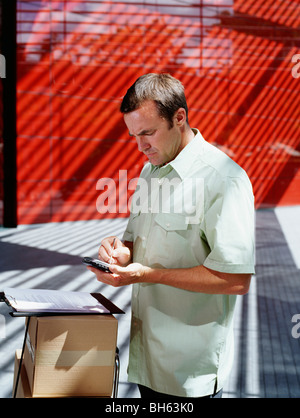 A courier delivers parcels Stock Photo