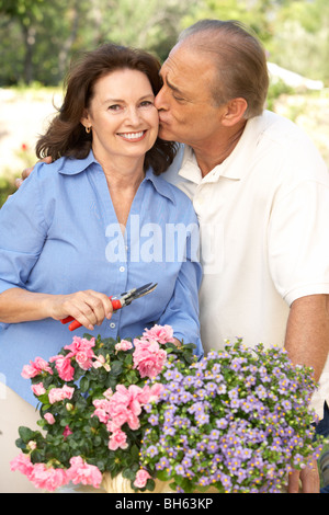 Senior Couple Gardening Together Stock Photo