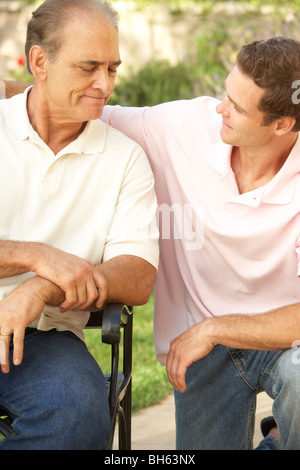 Senior Man Having Serious Conversation Adult Son Stock Photo