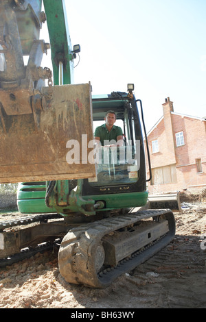 Construction Worker Using Digger Stock Photo