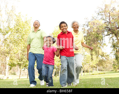 Grandparents In Park With Grandchildren Stock Photo