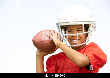 Young Boy Playing American Football Stock Photo