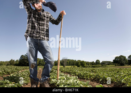 Exhausted farmer Stock Photo