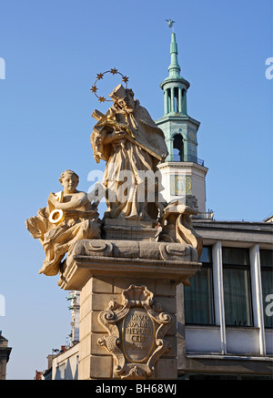 Statue St John Nepomuk religious figure holding cross with Jesus Christ Old Market Square Poznan Poland