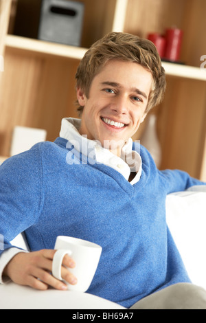 Young Man Relaxing With Cup Of Coffee Stock Photo