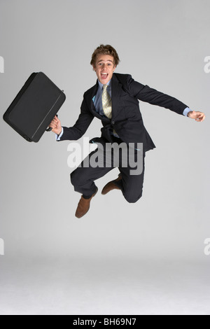 Businessman Jumping In Air Stock Photo