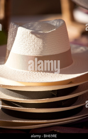 Several handmade straw hats at the market, Domme, Perigord Noir, France. Stock Photo