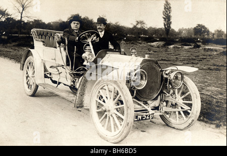 Two Distinguished Men Driving Large Touring Car Stock Photo