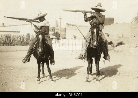 Two Mexican Revolution Cavalrymen Aiming Rifles Stock Photo