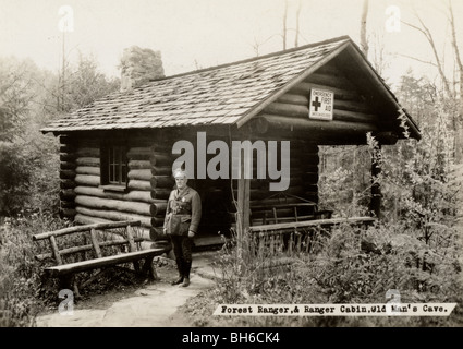 Forest Ranger at Log Cabin Emergency First Aid Station Stock Photo