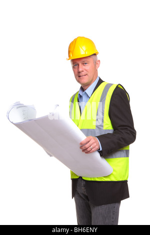 Building contractor wearing safety clothing holding some blueprints, isolated on a white background. Stock Photo