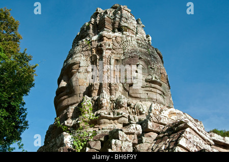 Face statue at the entrance to Ta Prohm, Angkor Wat, Cambodia Stock Photo