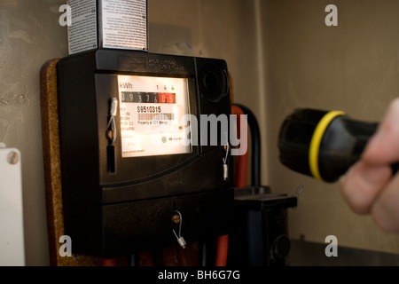 Checking the electricity meter Stock Photo