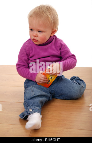 Unsupervised child playing with matches Stock Photo