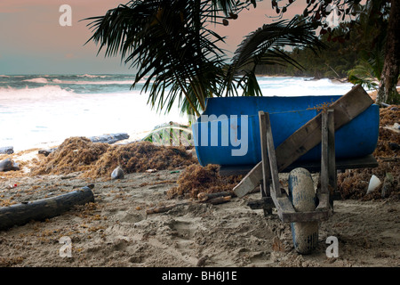 A work man's wheelbarrow on the beach at Punta Uva in Costa Rica Stock Photo
