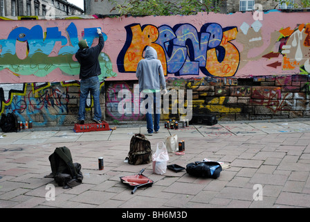 Graffiti painters working on the legal boards in Potterrow Edinburgh Stock Photo